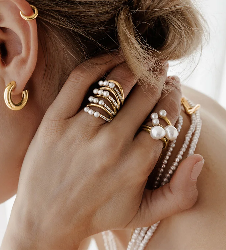 Model wearing Pandora pearl jewelry
