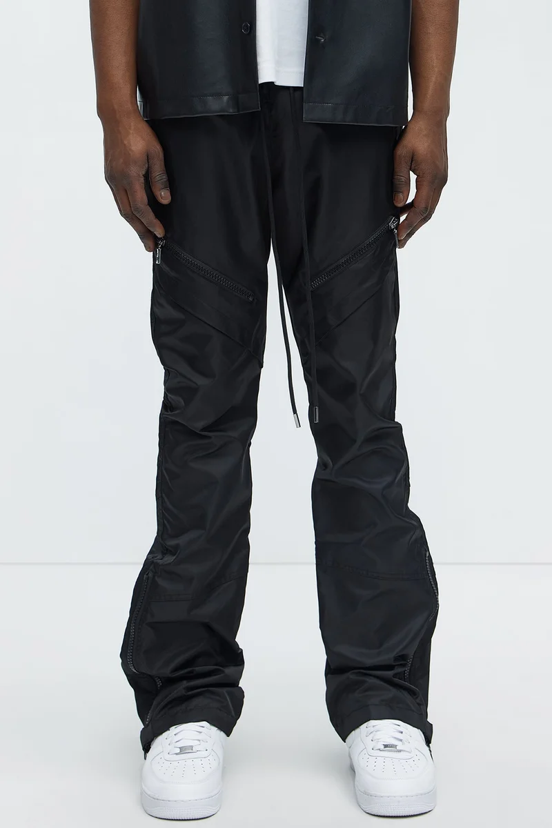 Image of Play The Track Stacked Slim Flare Nylon Pants - Black