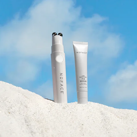 NuFACE FIX with FIX Line Smoothing Serum showcased in the sand.