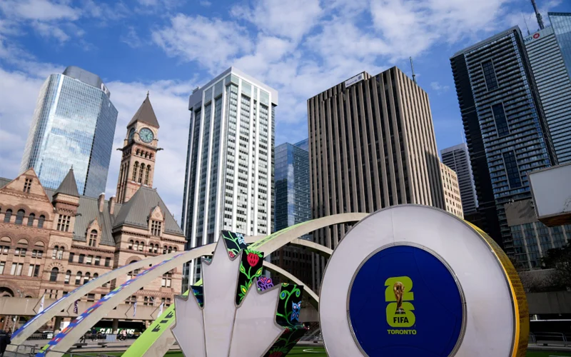 The Toronto sign decorated with FIFA World Cup graphics can be seen in Nathan Phillips Square.
