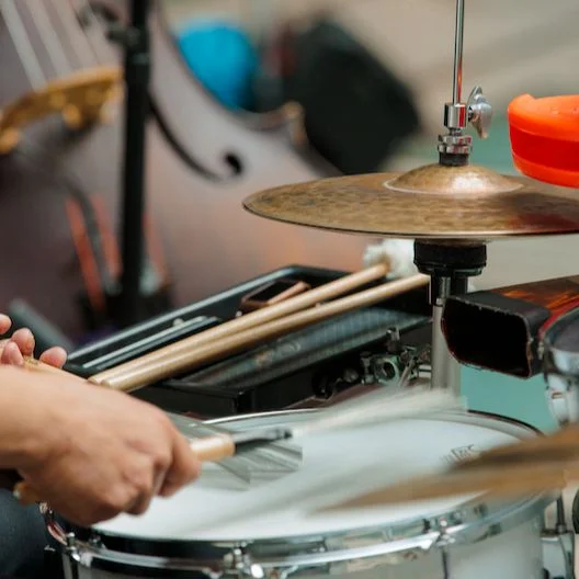 Hands playing the drums