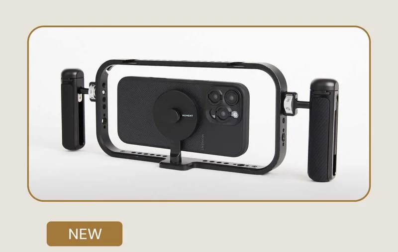 Image of moment phone in a filmmaker cage with grips