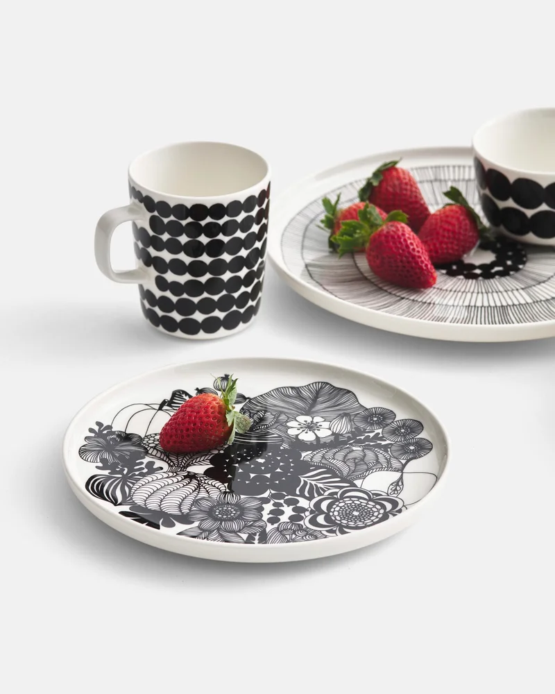 Plates and mug with strawberries.