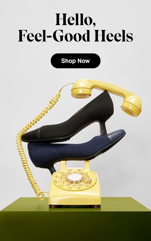 .The Gilly kitten-heel pump in Black and Navy perched atop a yellow rotary phone. Shop Now.