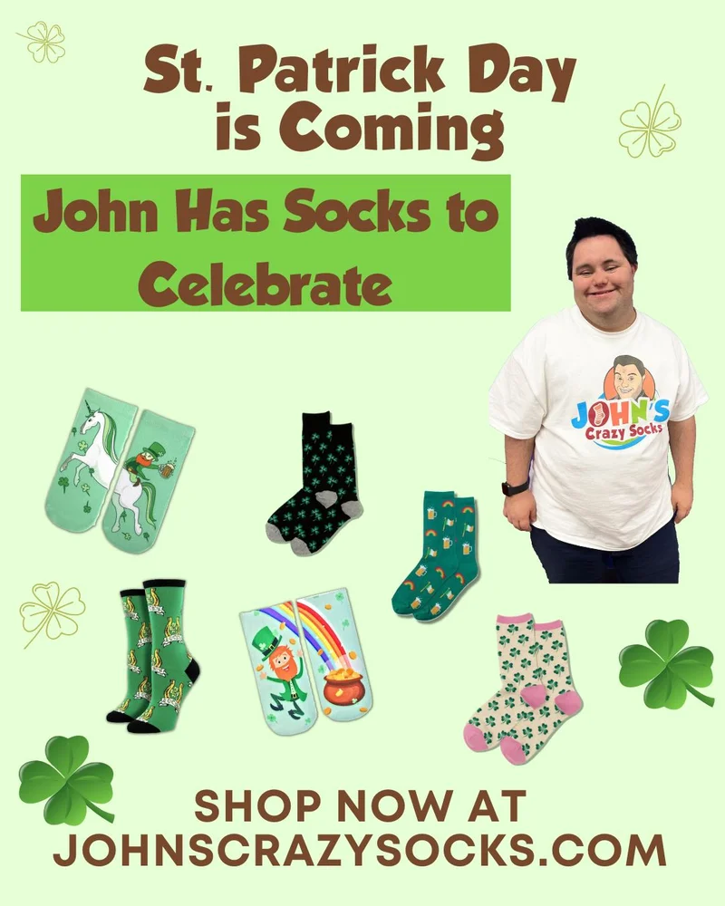 John standing next to an array of socks for St. Patrick's Day