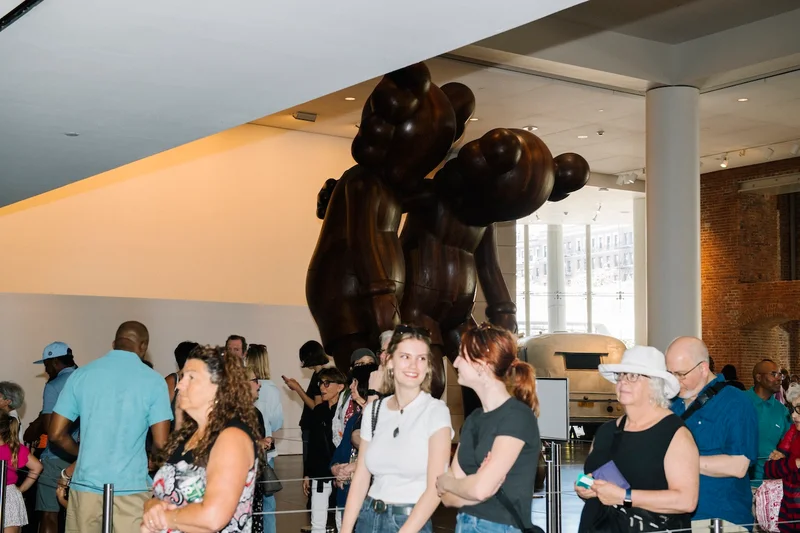 People standing in line in the Brooklyn Museum lobby