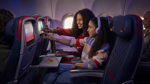 Delta customers use seatback entertainment onboard their Delta flight.