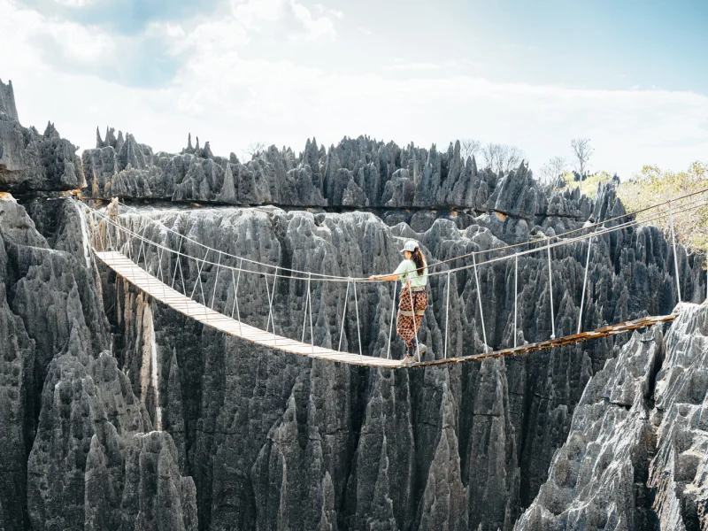 Tsingy de Bemaraha National Park, Woman crossing the wooden bridge