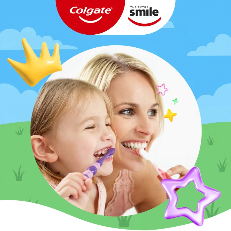 A circular image of a woman and child smiling as they brush their teeth. The image is on an animated background of a blue sky and grass with colorful crown and star graphics.