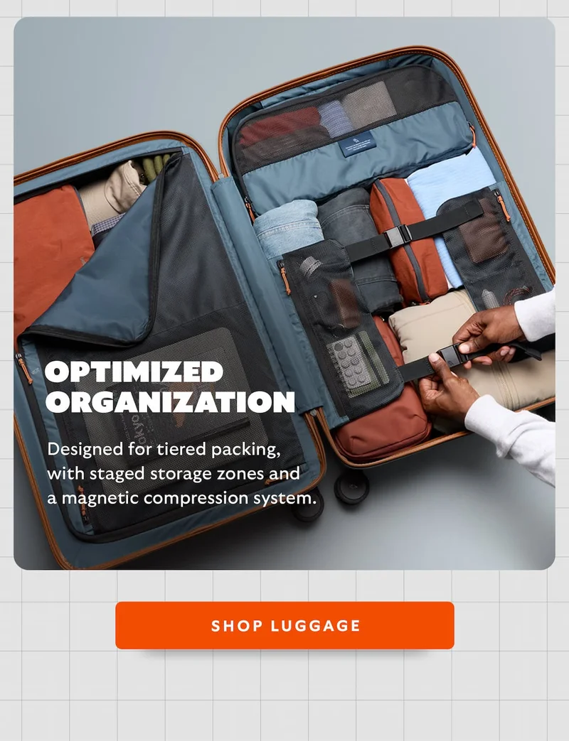 Designed for tiered packing, with staged storage zones and a magnetic compression system.