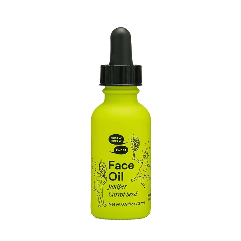 A green bottle of face oil with a black dropper top.