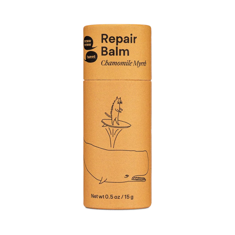 An orange paper tube of balm.