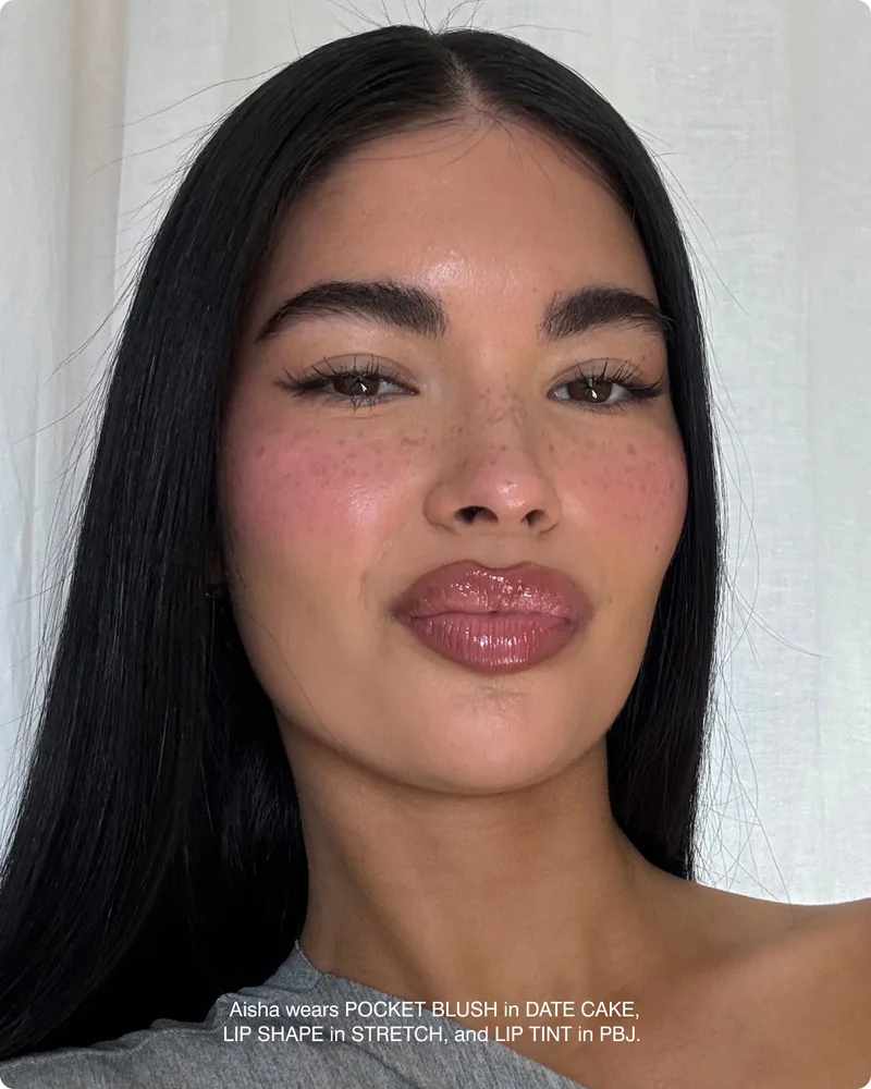 Aisha wears POCKET BLUSH in DATE CAKE, LIP SHAPE in STRETCH, and LIP TINT in PBJ.