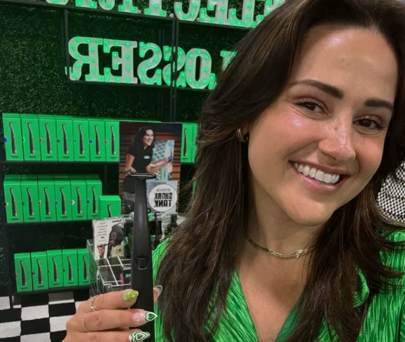 Image of Sam at the Flaus table at a dental conference