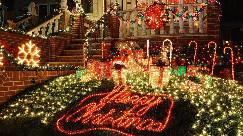 Image description: Christmas decorations lit up at night on house in Dyker Heights, Brooklyn