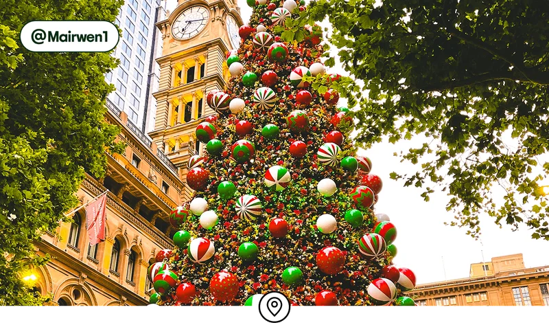 Image description: An ornament-covered Christmas tree in Sydney, photo taken by @Mairwen1
