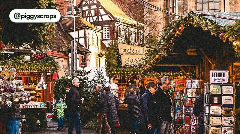 Image description: Travelers shopping at decorated stalls at a German Christmas markets, photo taken by @piggyscraps