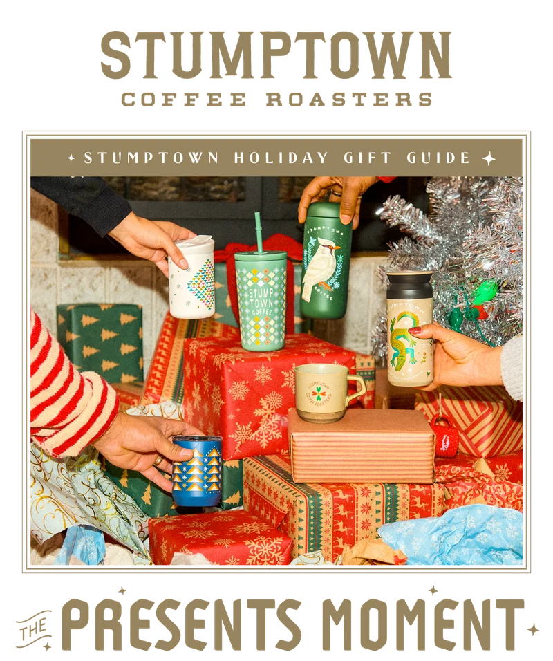 Festive backdrop with drink ware stacked on colorful packages.