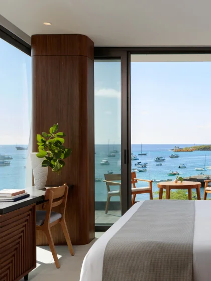 A guest room overlooking boats on the water