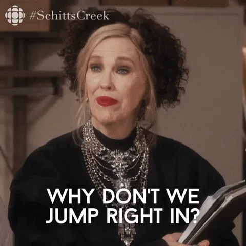 A gif of Schitts Creek's Moira Schitt saying, "Why don't we jump right in?"
