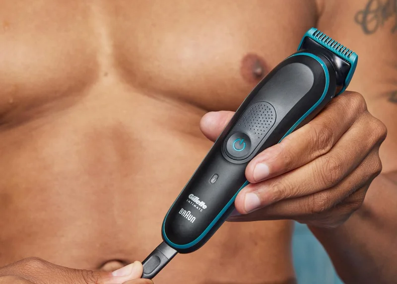 Man holding Gillette INTIMATE™ Pubic Hair Trimmer Man holding Gillette INTIMATE™ Pubic Hair Trimmer