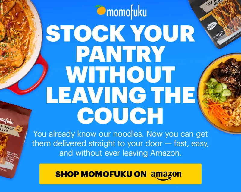 Header: STOCK YOUR PANTRY WITHOUT LEAVING THE COUCH. Sub-header: You already know our noodles. Now you can get them delivered straight to your door — fast, easy, and without ever leaving Amazon. CTA: SHOP MOMOFUKU IN AMAZON