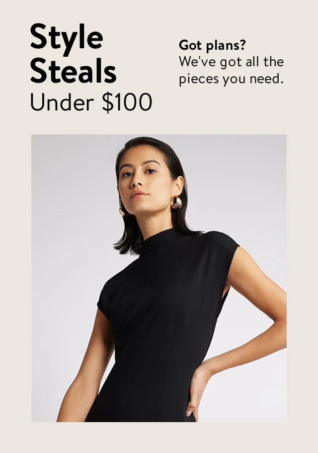 A woman wearing a black mock-neck dress.