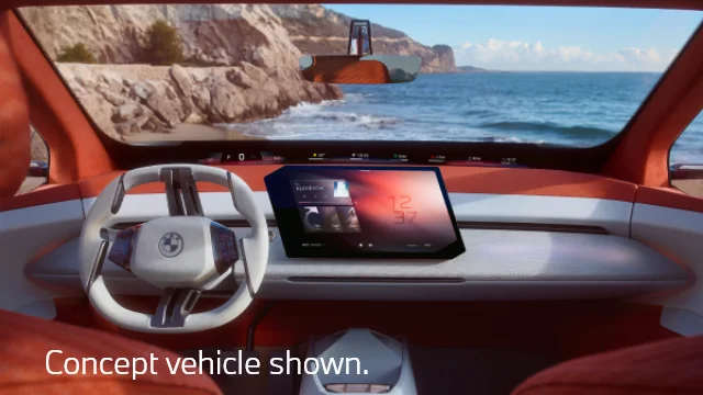 Interior of the Neue Klasse X overlooking the ocean through the windshield. Concept vehicle shown.