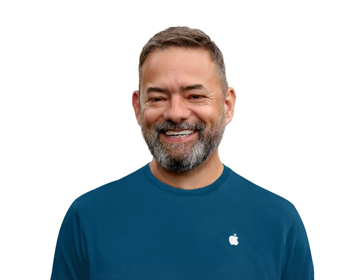 Headshot photo of a smiling Apple Store Specialist