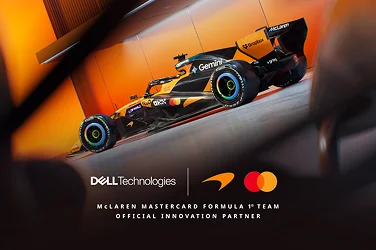 A McLaren Formula One race car parked at a dramatic angle.