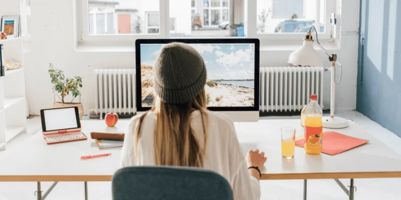 woman looking at a computer monitor