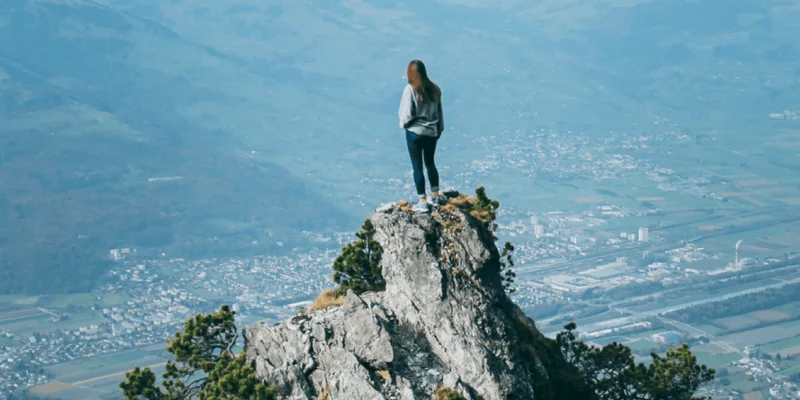 woman on top of a mountain