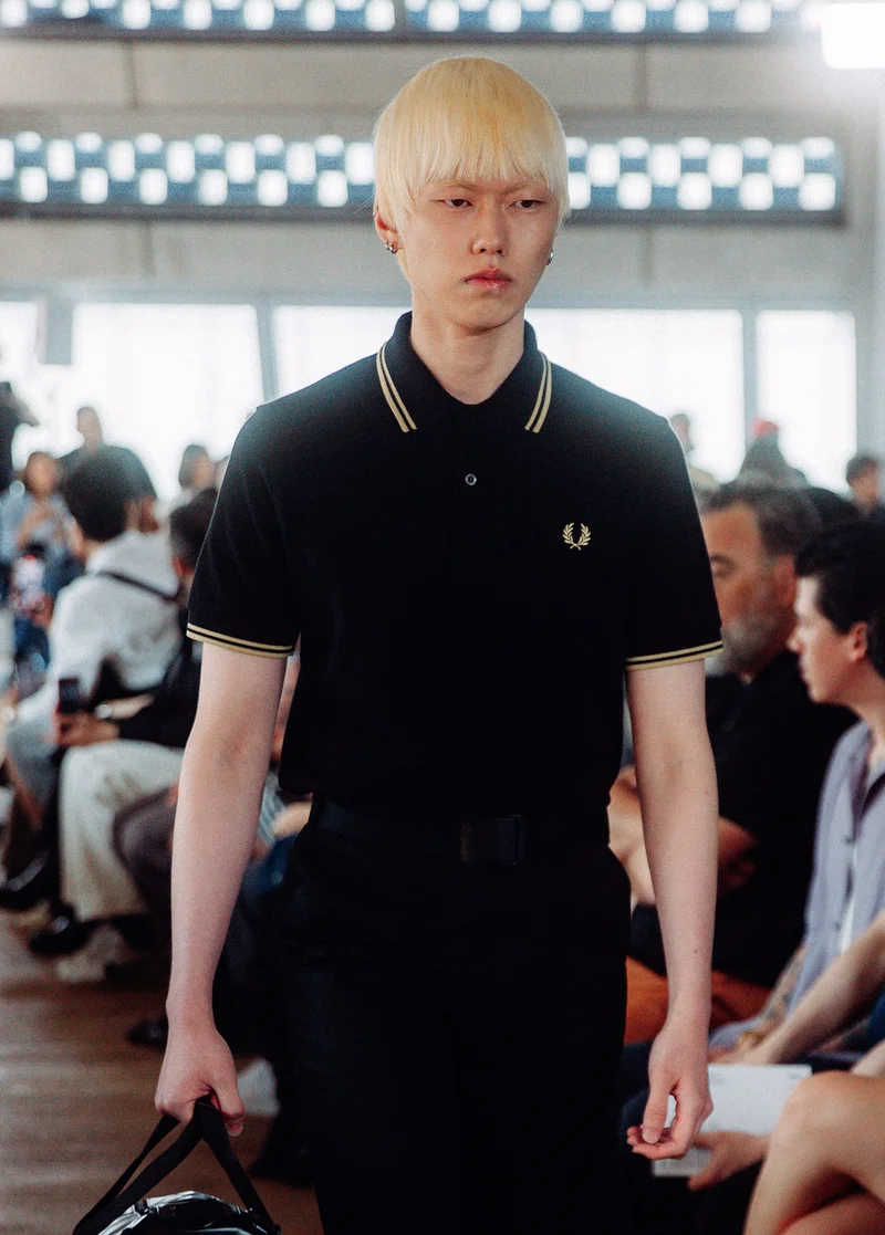 Male model wearing a Black / Champagne Fred Perry Shirt