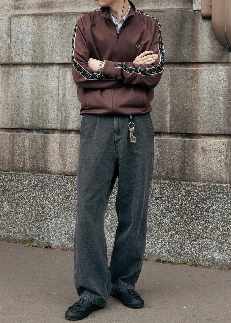 User Generated Content of man wearing a burgundy track jacket