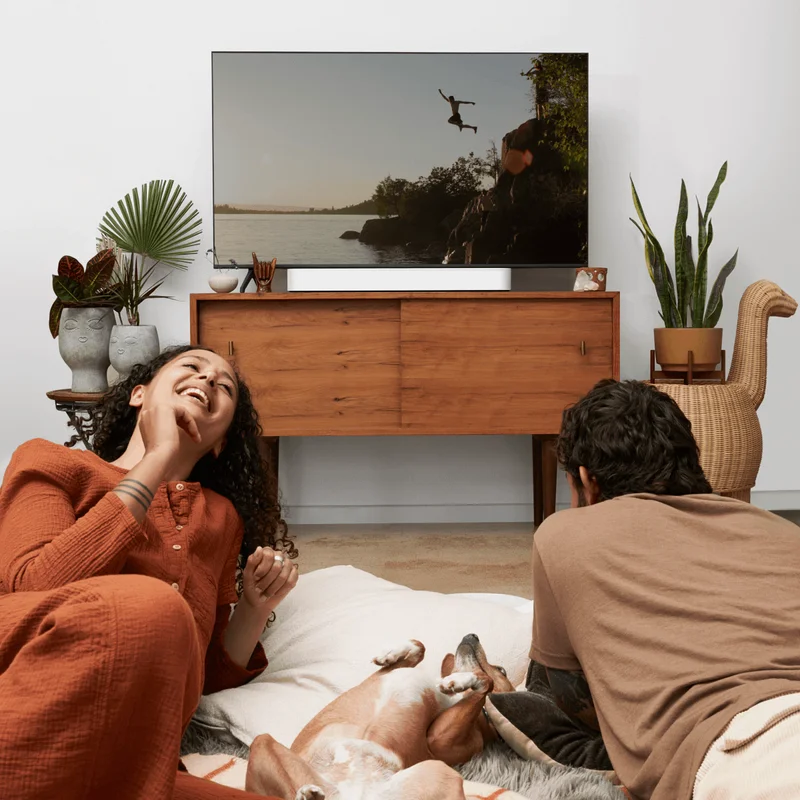 Sonos Beam couple watching tv with dog