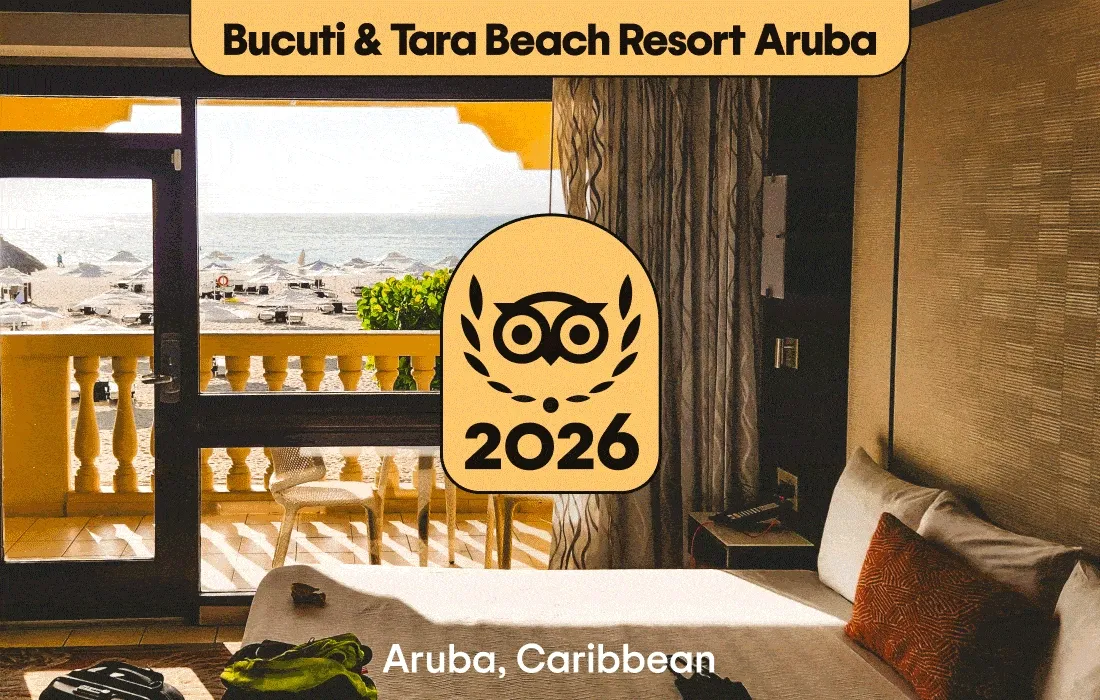 Image Description: A neutral-color hotel room with a view of the water at Bucuti & Tara Beach Resort Aruba in Aruba, the Caribbean, a pool surrounded by green trees and umbrellas at La Siesta Hoi An Resort & Spa in Hoi An, Vietnam, a hotel room with wood decor at Xela Tulum in Tulum, Mexico, a hotel room with a table with food and drinks at Royal Lancaster London in London, England. A gold 2026 Travelers’ Choice Best of the Best badge is on each image.
