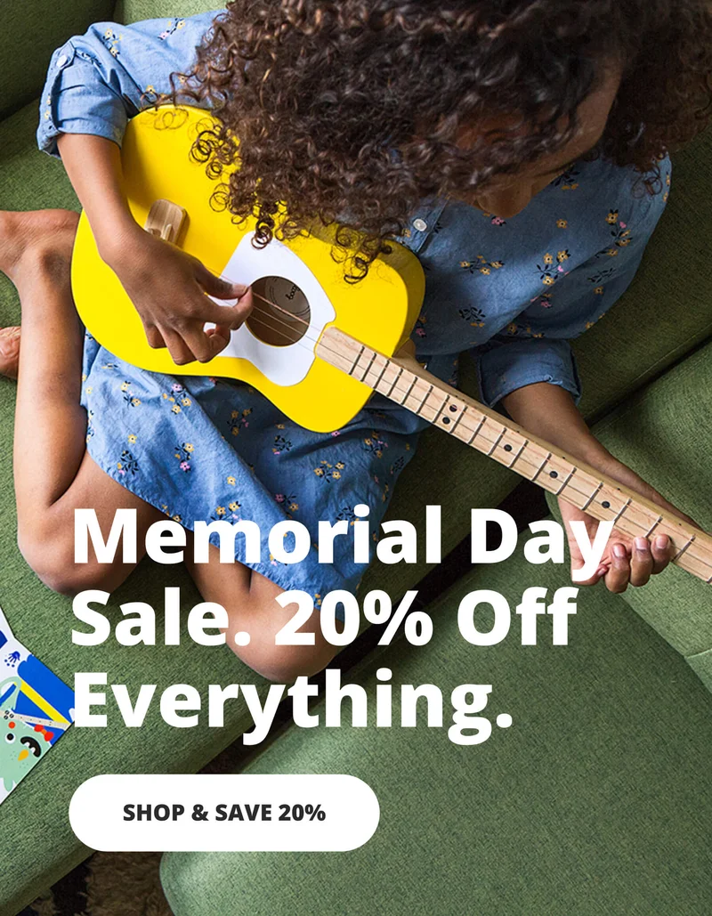 girl playing loog guitar - Memorial day sale 20% off evertyhing