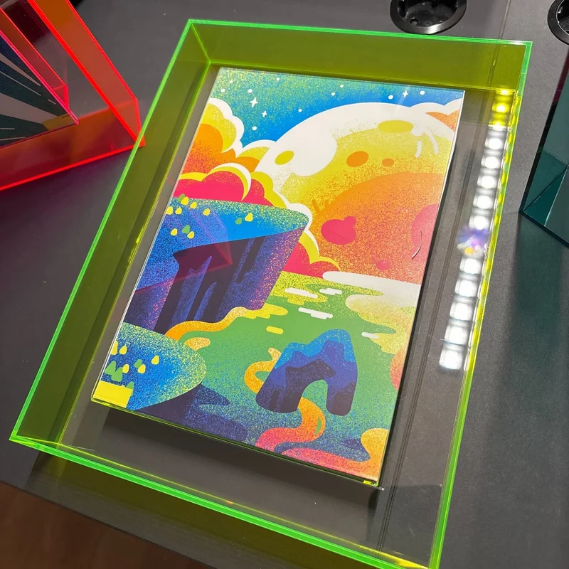 Framed neon artwork sample at the kurzgesagt office