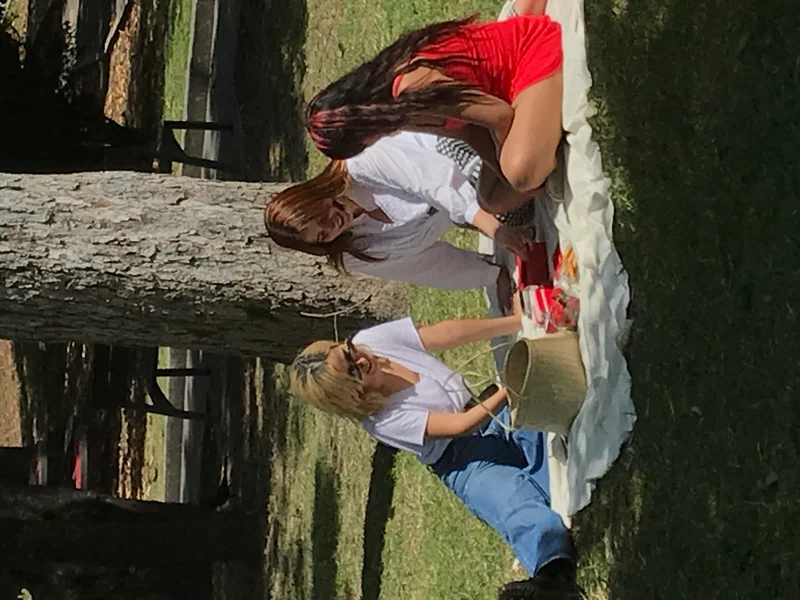 Girls playing Were Note Really Stangers card game in the park