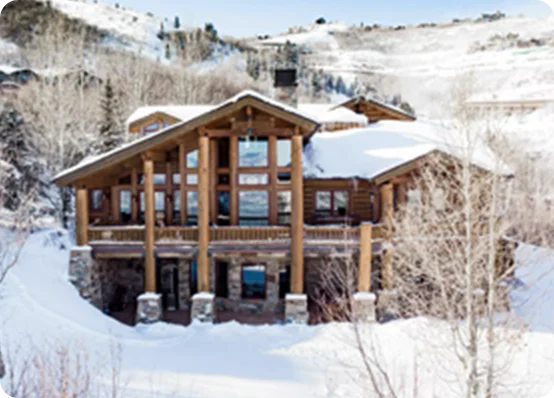 Escape to a snowy wonderland in a classic vacation rental with mountain views in Park City, Utah.