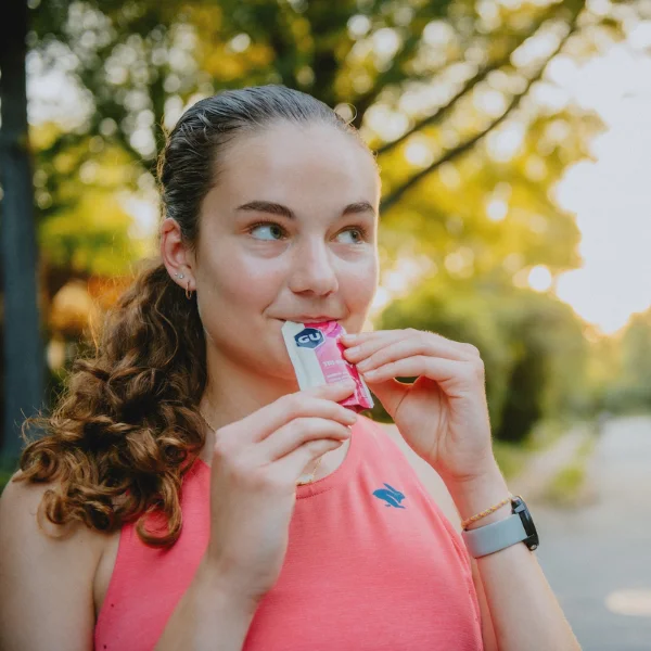 Woman eating an energy gel