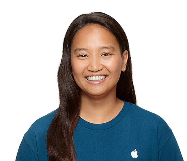 Headshot photo of a smiling Apple support specialist