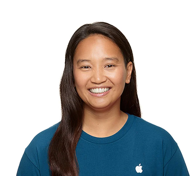 Headshot photo of a smiling Apple support specialist