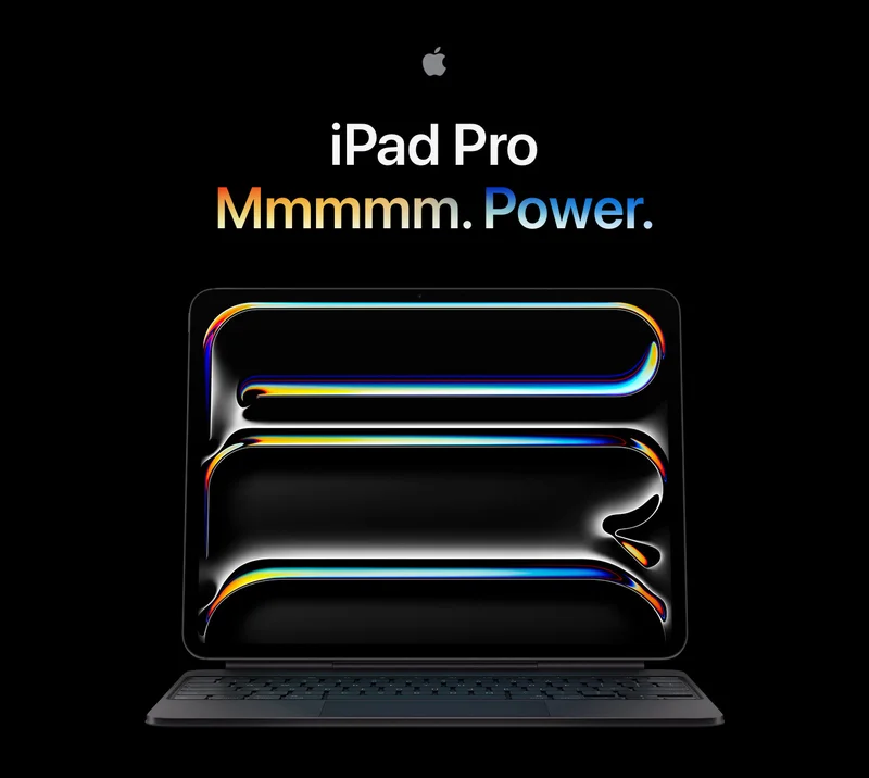 iPad Pro attached to Magic Keyboard, front exterior, with colorful, wavy graphics abstractly spelling 'PRO' from top to bottom