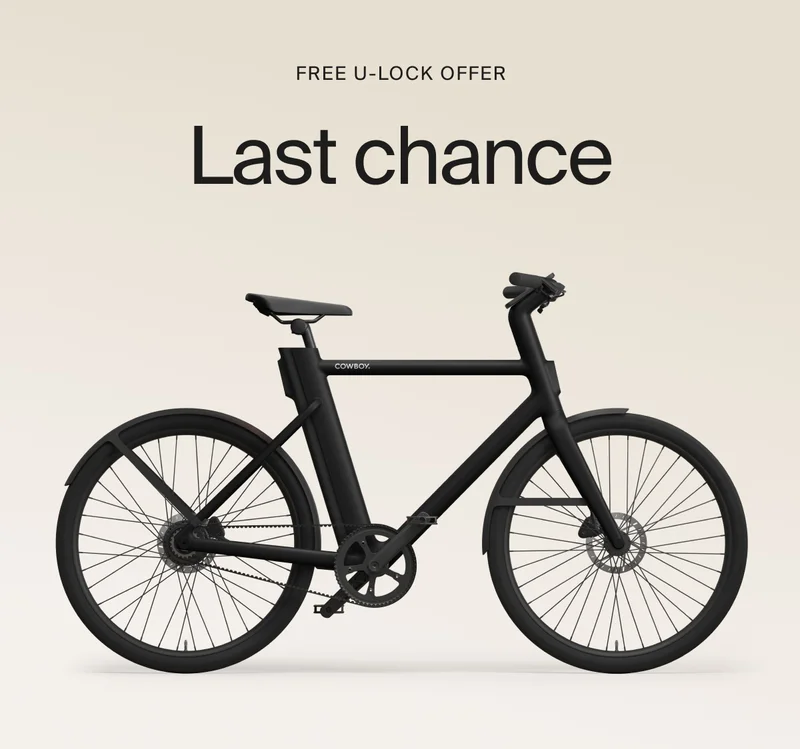 A graphic. Black Friday Cowboy promotion with a rendered e-bike offering €1000 off. Available on top-spec models.