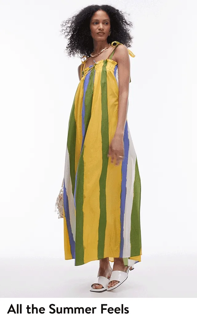 A man wearing a printed button-up top with matching shorts and clogs. A woman wearing a striped maxi dress with sandals.