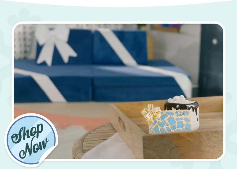 A Blueridge Nugget sits in the distance wrapped in a bow. In focus, a gift card is displayed in a tray.