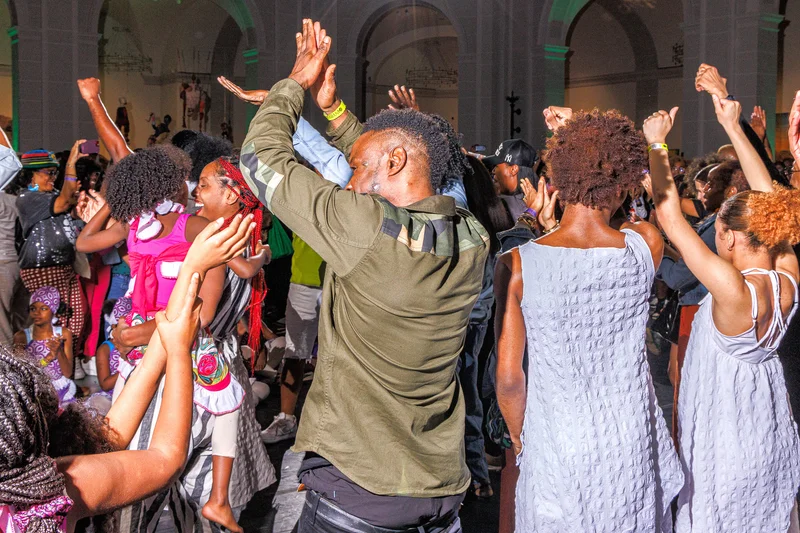 People standing together cheering and dancing