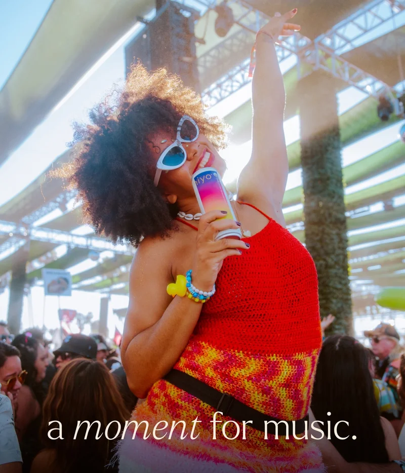 a moment for music. girl rocking out day trip fest and enjoying a blackberry lemon hiyo.