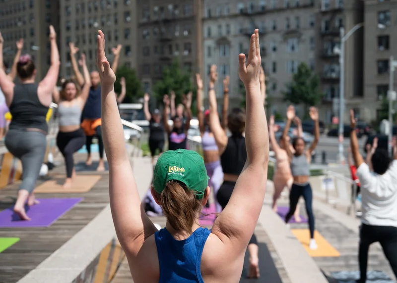 People doing yoga on the Brooklyn Museum stoop